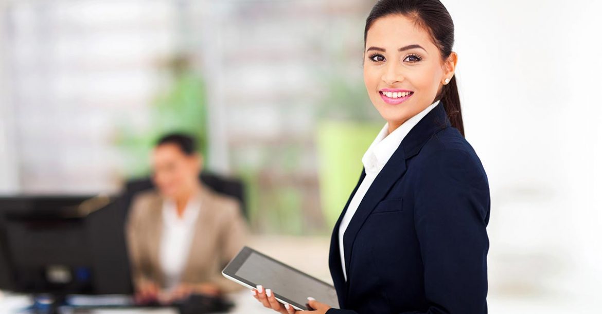 Modern businesswoman holding tablet