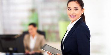 Modern businesswoman holding tablet