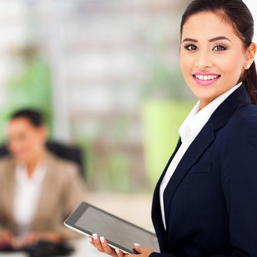 Modern businesswoman holding tablet