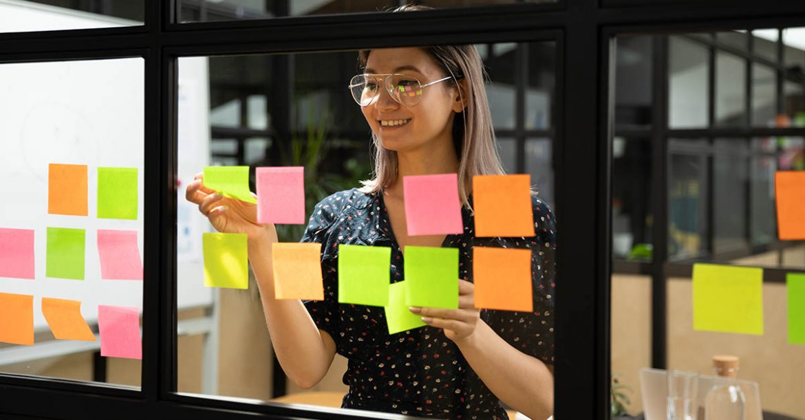 Young vietnamese female scrum master organising project working process