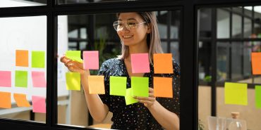 Young vietnamese female scrum master organising project working process