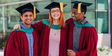 Three college graduates