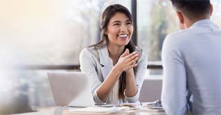 Cheerful buisnesswoman meets with colleague