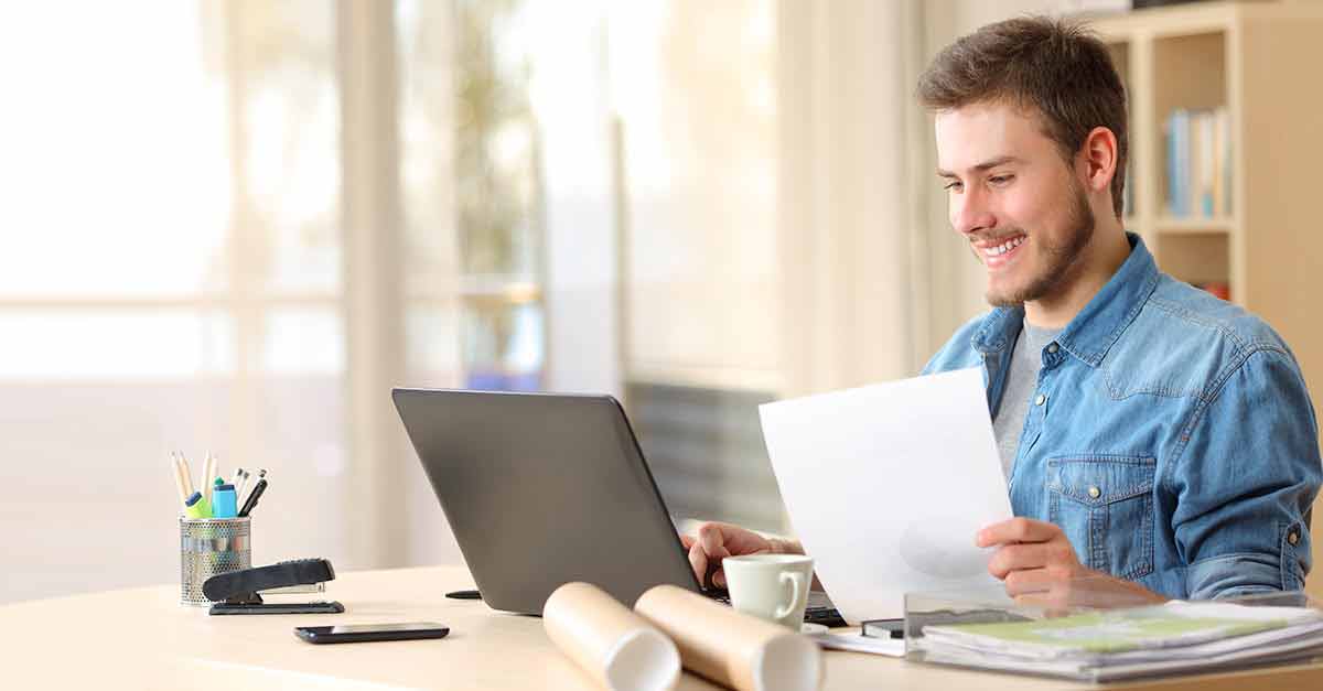 Entrepreneur working with laptop and document