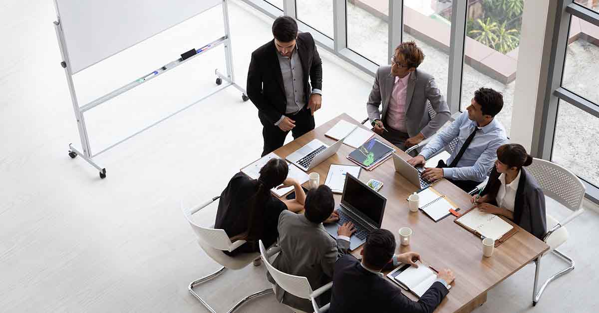 op view of group of multiethnic busy people working in an office