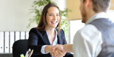 Businesspeople handshaking after interview