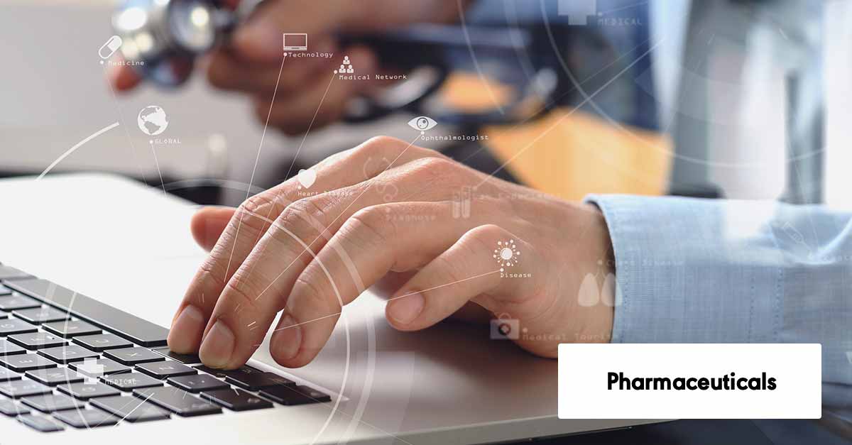 medical doctor working with laptop computer and mobile phone and stethoscope on dark wooden desk