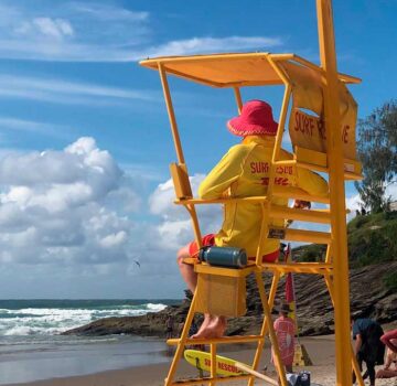 Lifeguard patrolling beach
