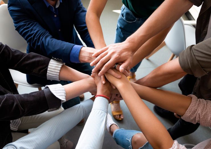 hands stacked together as symbol of teambuilding